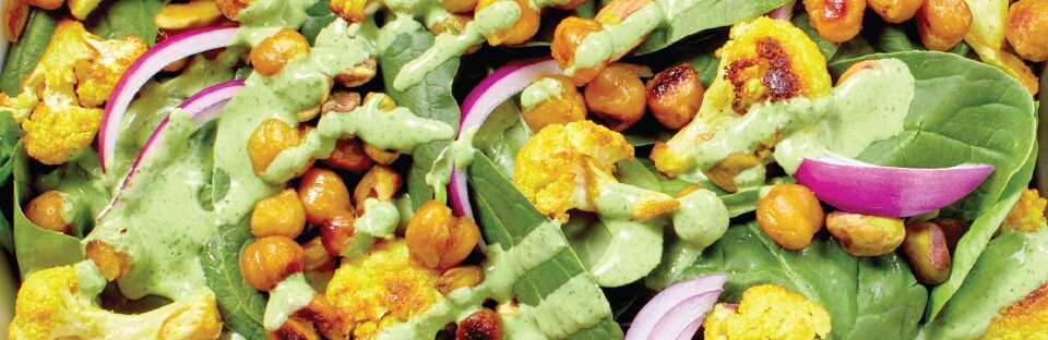 Close-up of Warm Cauliflower and Chickpea Salad with Cilantro-Yogurt Dressing