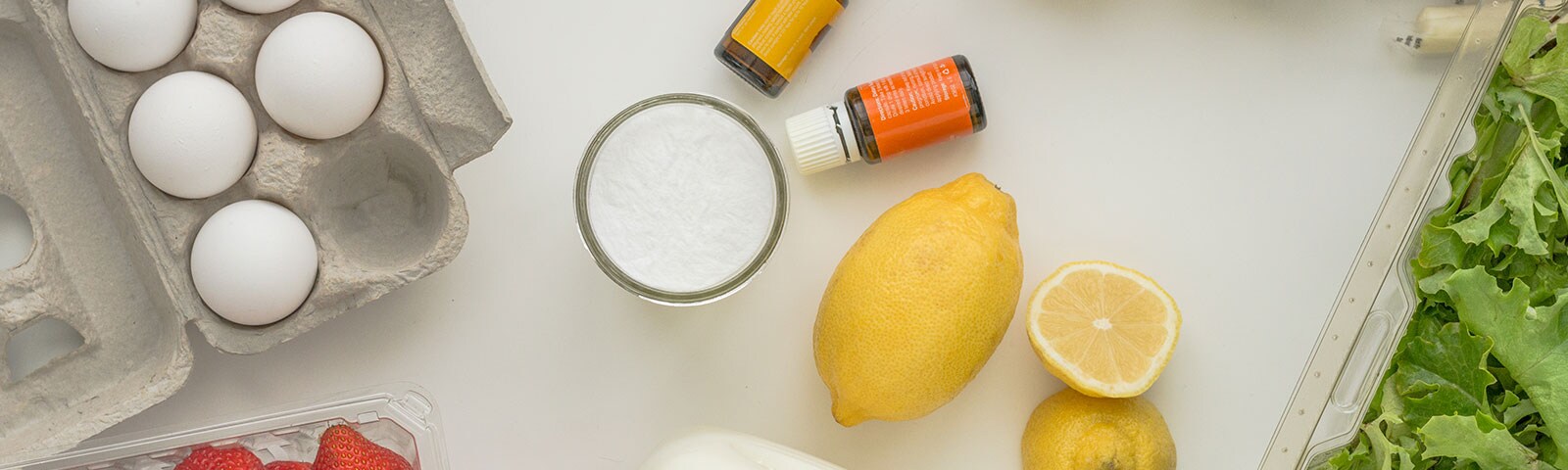 Countertop with a carton of eggs, essential oils and lemons Countertop with a carton of eggs, essential oils and lemons