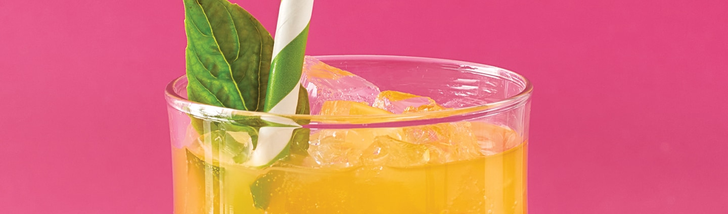 closeup of cocktail glass with pineapple surprise drink